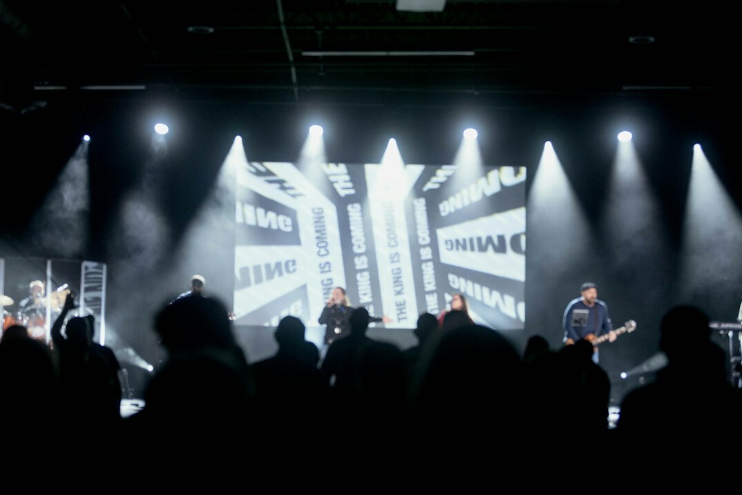 Lit stage with presentation lighting for a live show