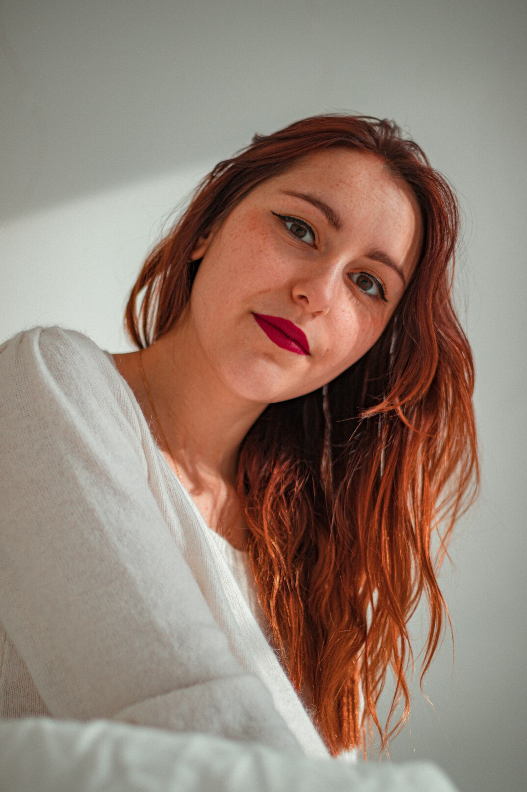 Portrait of a woman with auburn hair smiling